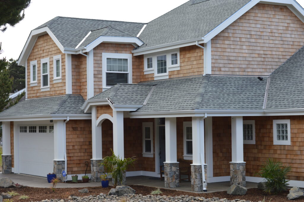 House with brown shingles.